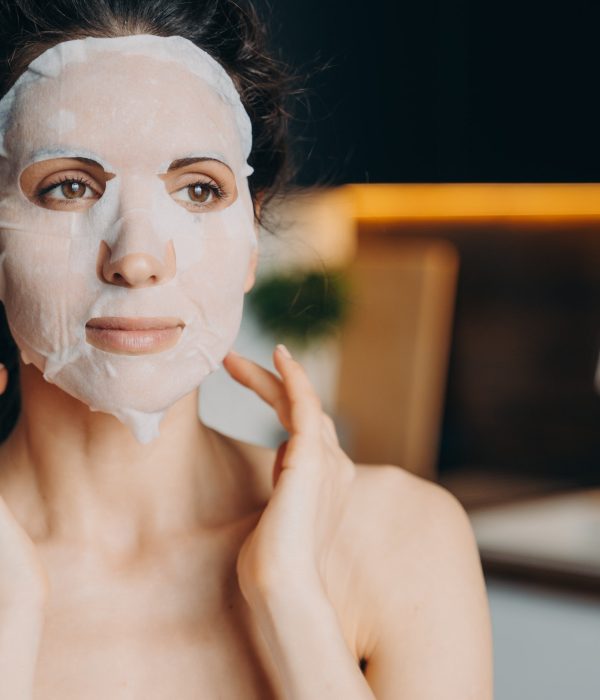 female-with-naked-shoulders-uses-rejuvenation-facial-sheet-mask-skin-treatment-at-home-skincare.jpg